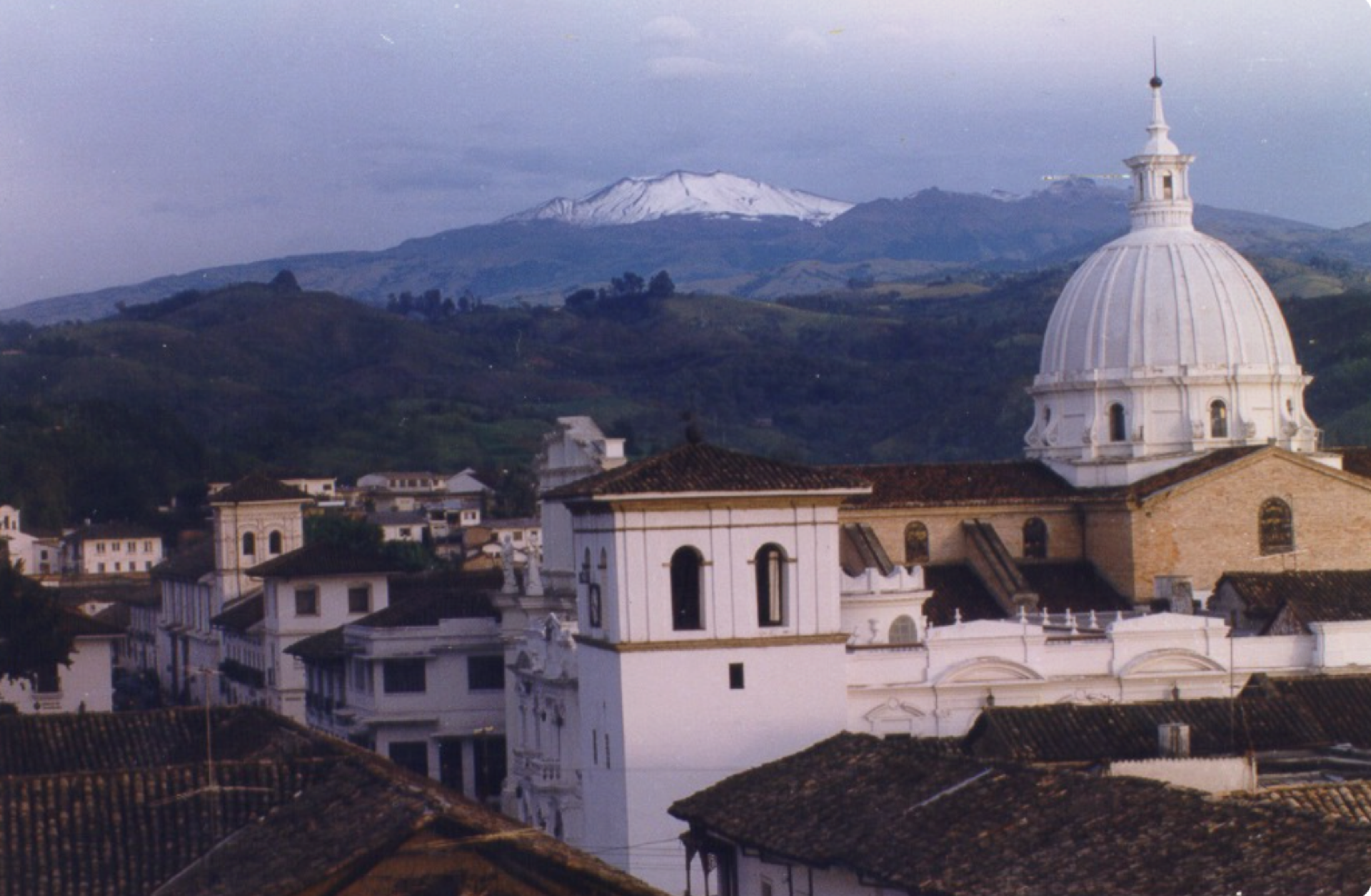 Historic architecture in Popayán, Colombia, with the Puracé volcano in the distance